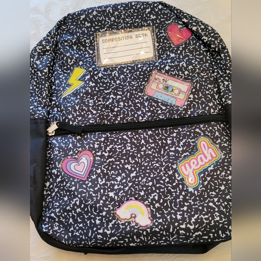 Black and White Patterned Backpack with Colorful Patches
